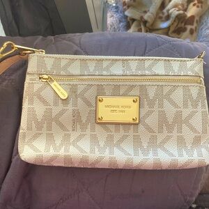 Michael Kors clutch with wrist strap never used tan with the mk logo